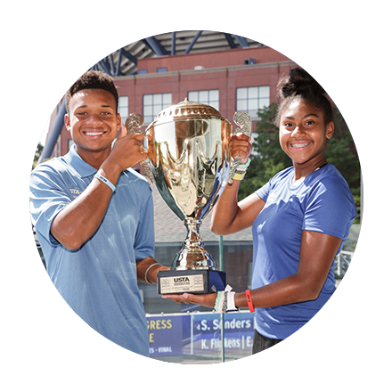 NJTL young people with trophy