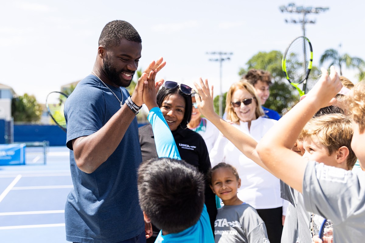 Francis Tiafoe high fiving students at Delray Beach clinic. Francis Tiafoe high fiving students at Delray Beach clinic.