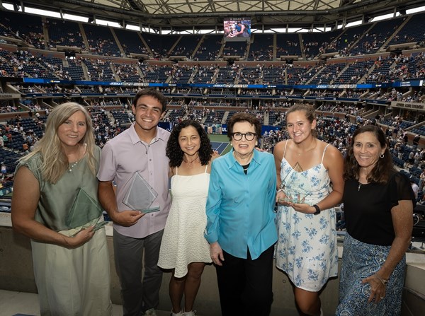 Donnelly Award winners meeting Billie Jean King at the US Open and taking a picture in Arthur Ashe